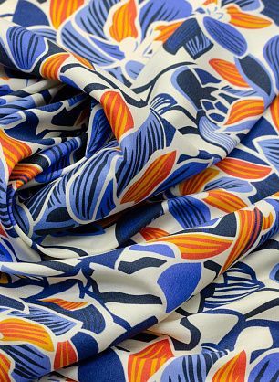 Шелк атлас стрейч (н) сине-оранжево-голубой цветочный орнамент на айвори - в интернет-магазине тканей Тессутидея арт. 02-8561