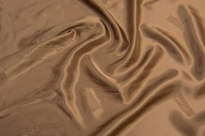 Подкладочная вискоза (о) бронзовая с надписью Max Mara - итальянские ткани Тессутидея арт. 08-1188