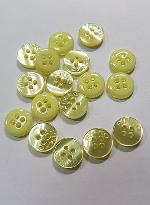 Пуговица пластик 4 прокола d-9мм желтая перламутровая Pinko - в интернет-магазине тканей Тессутидея арт. F-5561