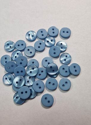 Пуговица пластик 2 прокола d-9мм голубая - в интернет-магазине тканей Тессутидея арт. F-5758