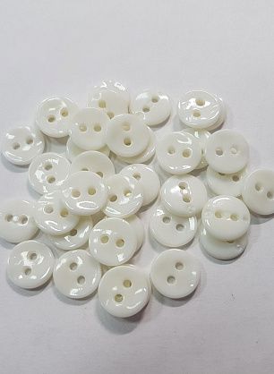 Пуговица пластик 2 прокола d-11мм белая  - в интернет-магазине тканей Тессутидея арт. F-5285