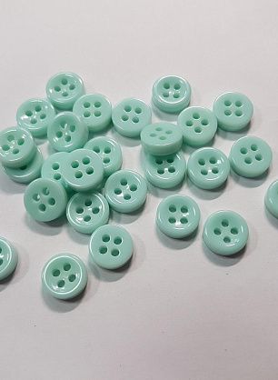 Пуговица пластик 4 прокола d-10мм светло-бирюзовая - в интернет-магазине тканей Тессутидея арт. F-5548