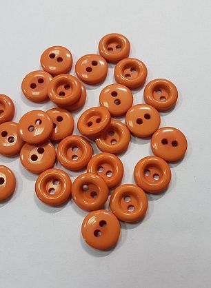 Пуговица пластик 2 прокола d-12мм оранжевая - в интернет-магазине тканей Тессутидея арт. F-5319